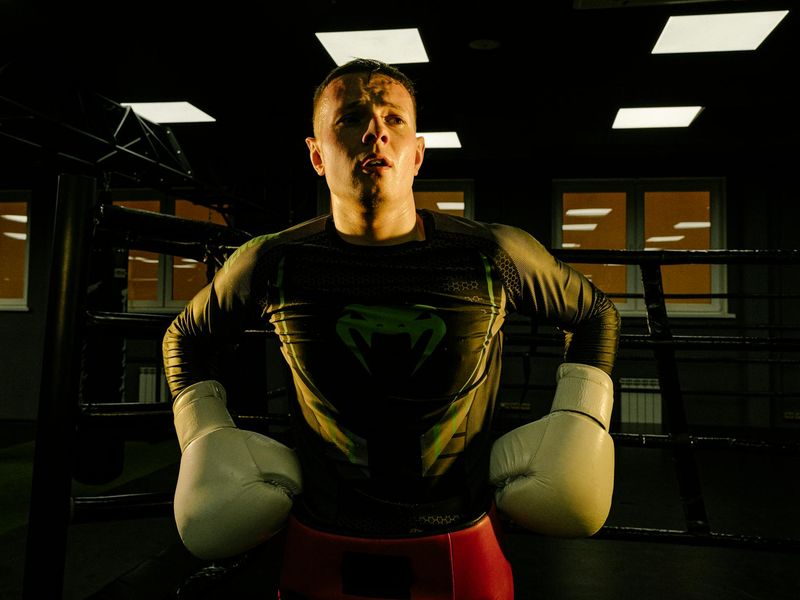 Close-up on a person's focused expression during a workout.